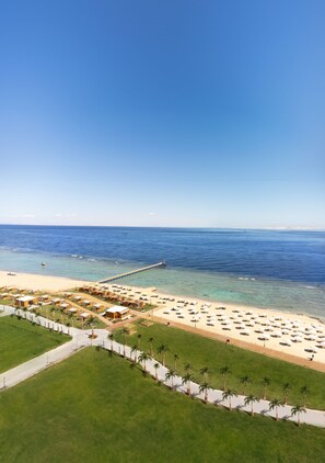 On the beach, beach umbrellas, beach towels, beach bar