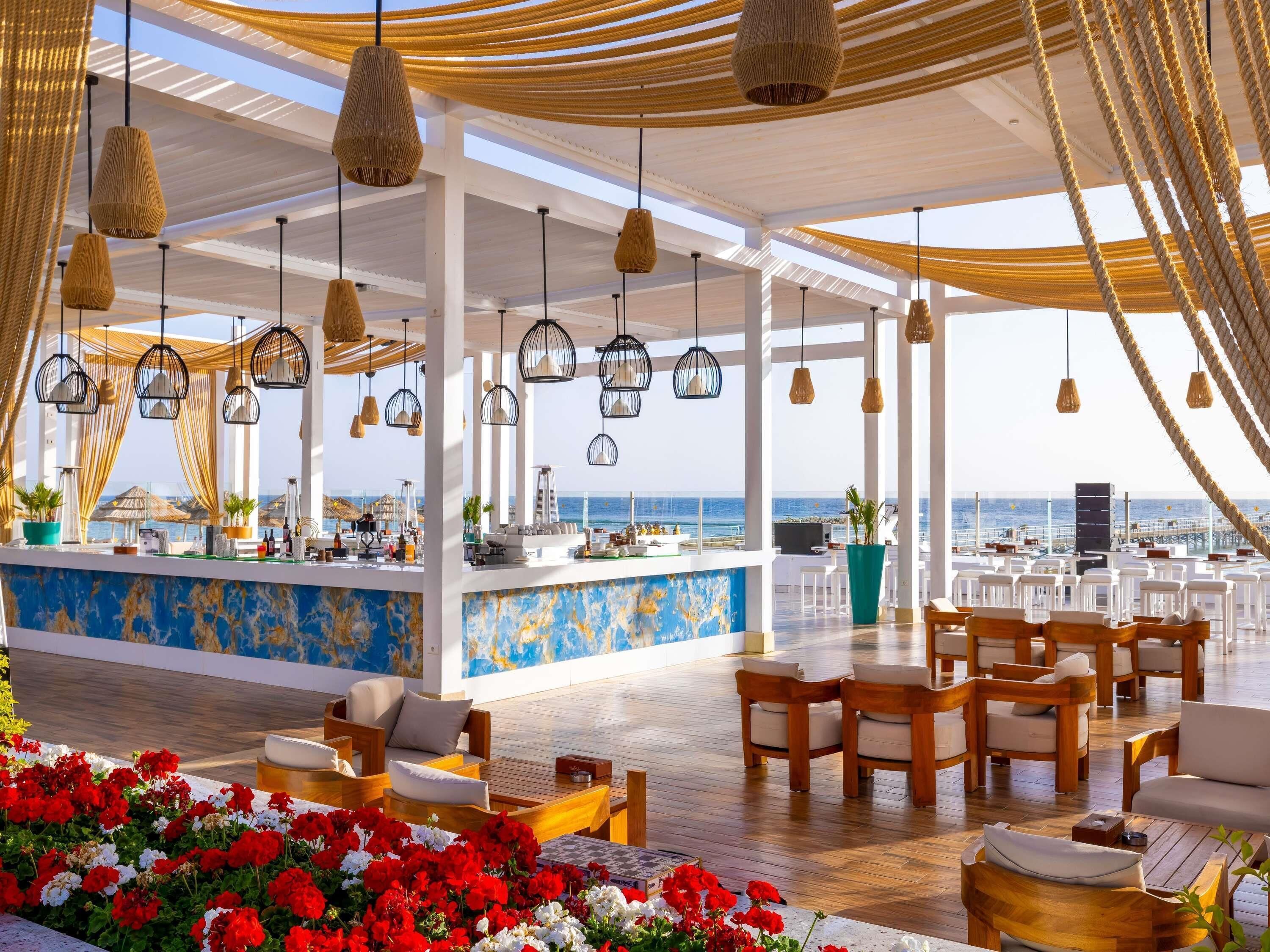5 bars/lounges, poolside bar, beach bar