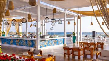 5 bars/lounges, poolside bar, beach bar