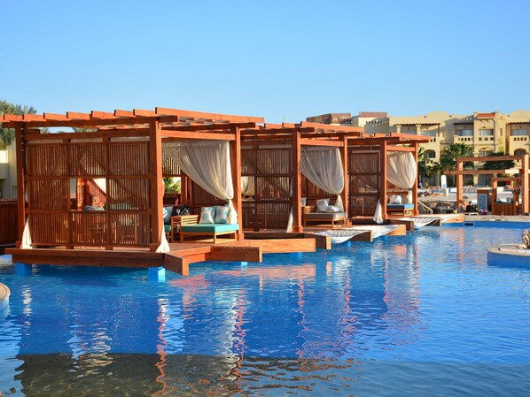 5 bars/lounges, poolside bar, beach bar