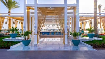 5 bars/lounges, poolside bar, beach bar