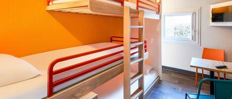 A bunk bed room with a desk and chair, a window, and a TV.