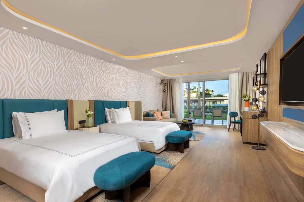 Deluxe Room Beach side | Literie de qualité supérieure, articles gratuits dans le mini-bar