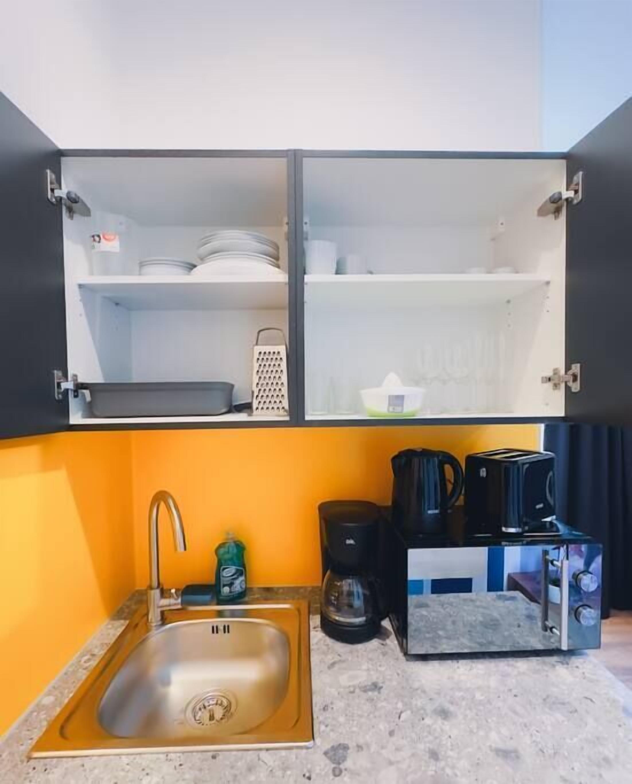 Fridge, microwave, stovetop, coffee/tea maker