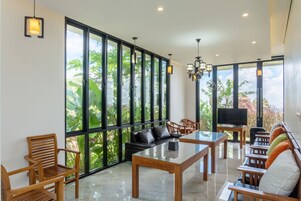 Family Villa | Living area | 32-inch LCD TV with digital channels