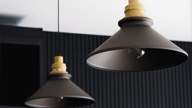 Two pendant lights with wooden shades hanging from a ceiling. - Premier Umalas Villas (Kerobokan)
