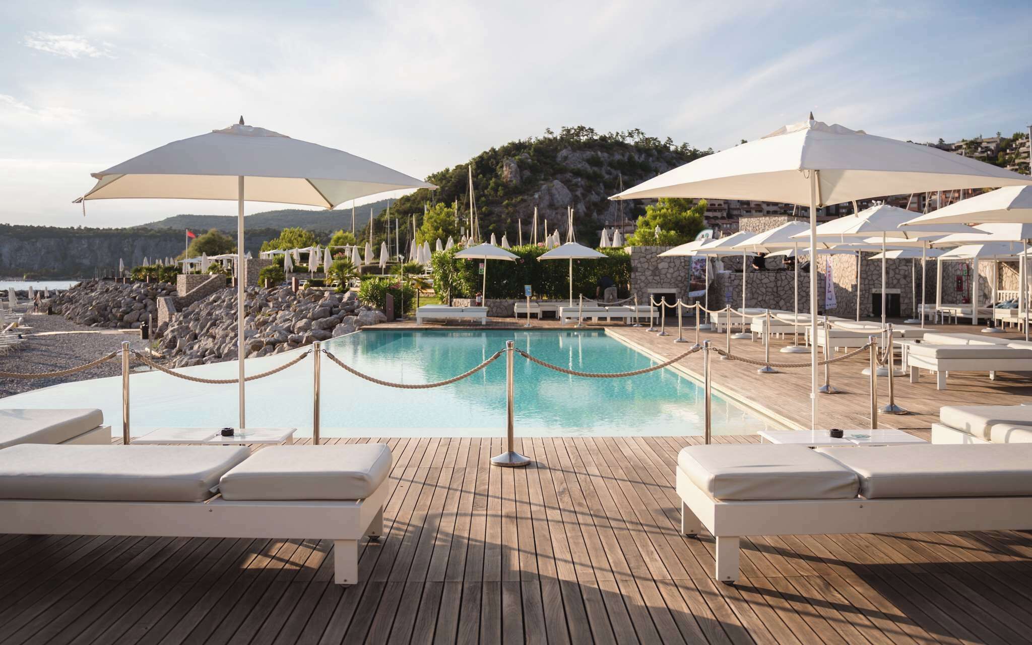 Seasonal outdoor pool, open 8:00 AM to 8:00 PM, pool umbrellas