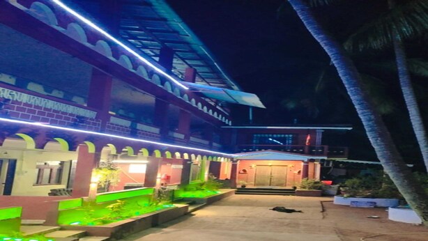 A two-story building with a balcony and a covered entrance. - GoanFiesta Beach House Calangute (Calangute)
