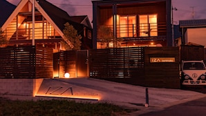 A modern two-story building with a prominent entrance and a sign reading "IZAI ounimaiko". - IZA oumimaiko (Otsu)
