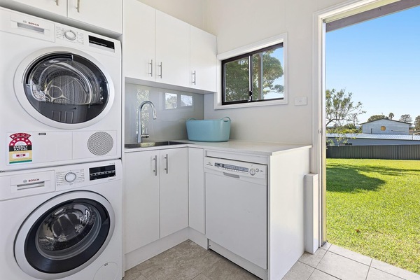 Downstairs laundry with washing machine and dryer