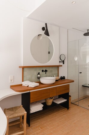 Designer toiletries, hair dryer, bathrobes, slippers