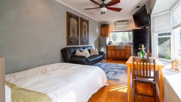 1 bedroom, desk, iron/ironing board, travel crib