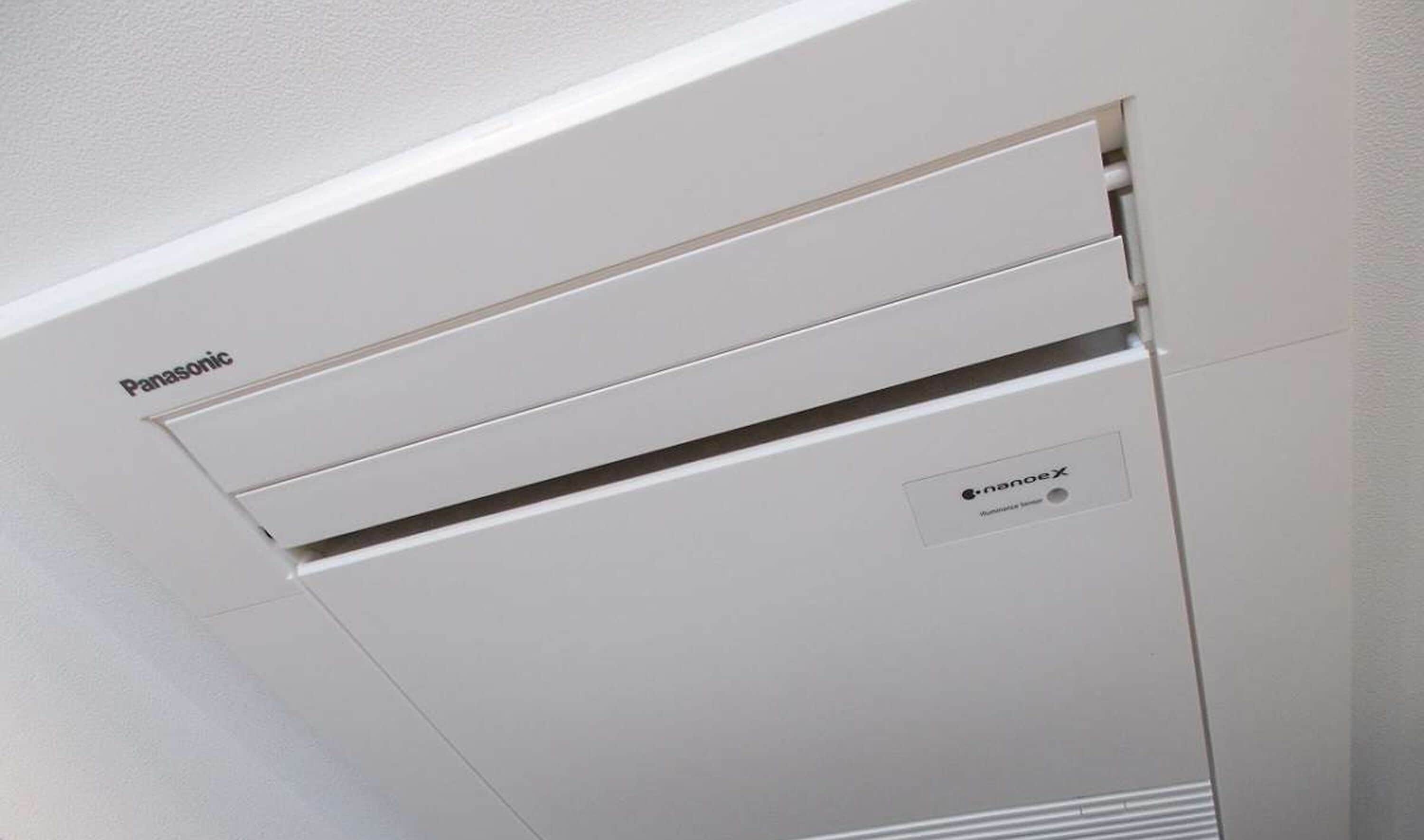 A white Panasonic air conditioning unit with a nanoX label on the side.