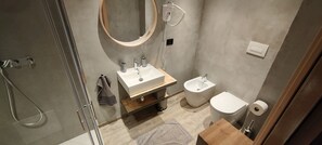 Shower, rainfall showerhead, hair dryer, towels