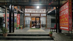 A hotel entrance with a sign indicating a luxury room is now open. - Hotel Lotus Paradise (Sonepat)