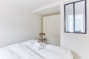 1 bedroom, desk, iron/ironing board, travel crib