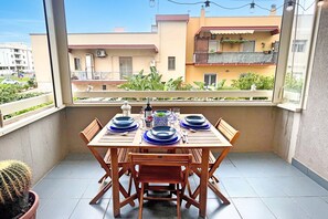 Family Apartment, Multiple Bedrooms, Refrigerator & Microwave (Monopoli Beach House 200 m from the) | Dining - Monopoli Beach House 200 m From the sea (Monopoli)