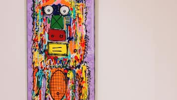 A colorful abstract painting on a wall.
