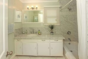 Shower, hair dryer, towels, shampoo