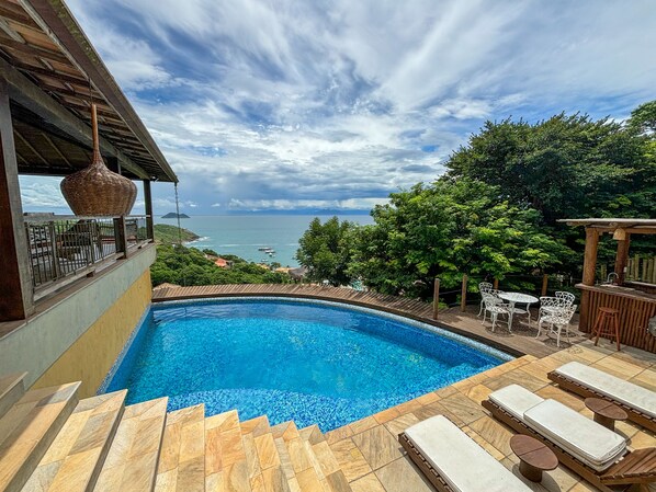 Outdoor pool, open 10:00 AM to 8:00 PM, pool loungers