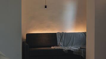 Deluxe Suite (Anton) | Living area | Flat-screen TV, smart speakers