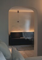 Deluxe Suite (Anton) | Living area | Flat-screen TV, smart speakers