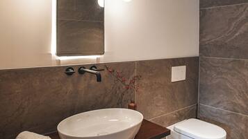 Shower, rainfall showerhead, hair dryer, towels