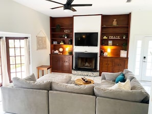 Smart TV, fireplace, books