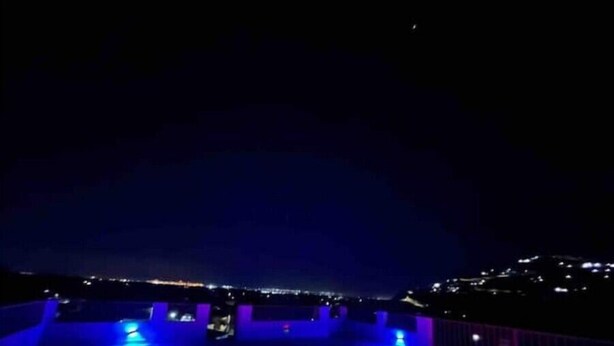 A nighttime view of a rooftop terrace with a cityscape in the background. - Quiet , pool, gated,security (kingston 19)