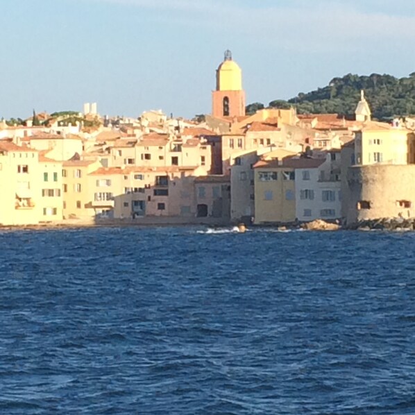 A coastal town with buildings along the waterfront.