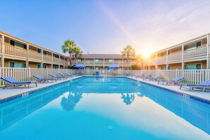 Relax by the pool surrounded by comfortable lounge chairs and take in the views from the hotel's balconies.