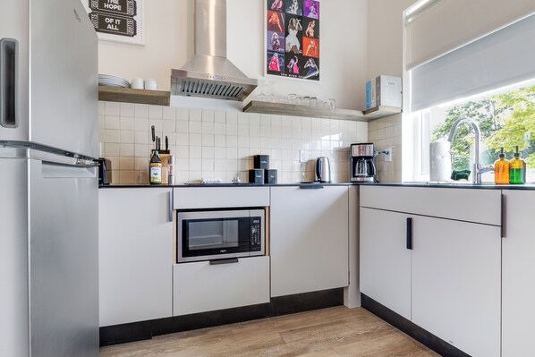 Fridge, microwave, stovetop, coffee/tea maker