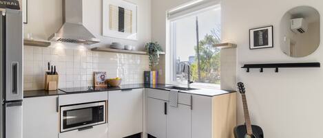 Fridge, microwave, stovetop, coffee/tea maker