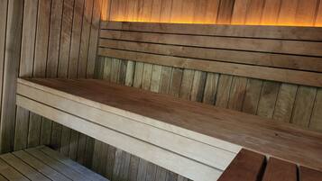 Relax in the 6 person forest sauna for hire