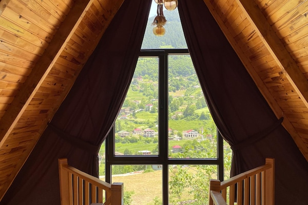 Deluxe Bungalow | Living area | Flat-screen TV, fireplace