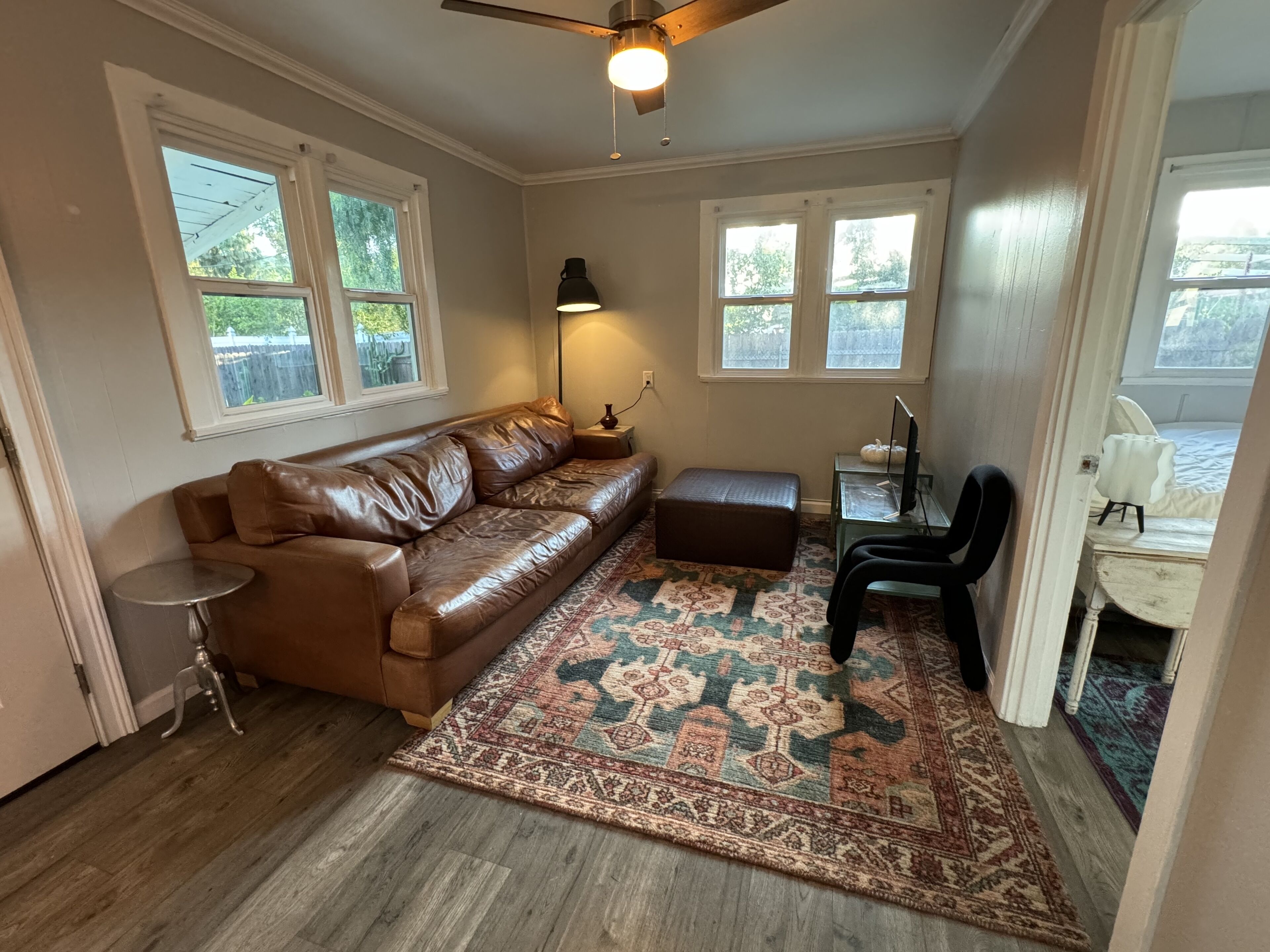 Dog friendly cottage with porch, pool, massive yard, and plenty of parking.