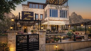 A two-story building with a sign reading 'Yellow Stone House.' - Yellow Stone Suites (Nevsehir)