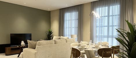 Design Apartment, 3 Bedrooms | Living area | Flat-screen TV