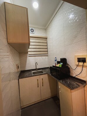 Mini-fridge, microwave, coffee/tea maker, electric kettle