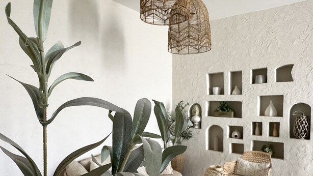A room with a large plant, a wicker pendant light, and a textured wall with built-in shelves. - Ar Rabi H-10 Royal touch Balcony AG98 (Riyadh)