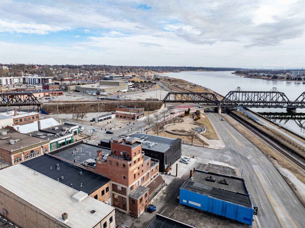 An industrial area with warehouses, a bridge, and a river.