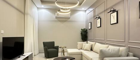Design Apartment, 2 Bedrooms | Living area | Flat-screen TV
