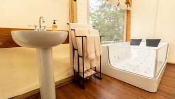 Shower, jetted tub, towels, soap