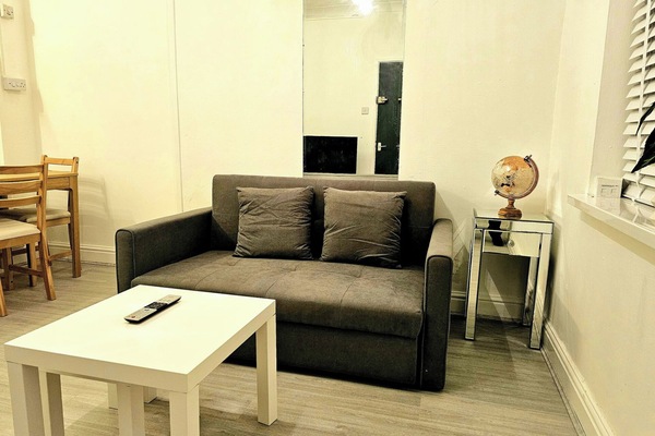 Whether you're catching up on work, spending a quiet evening in, or sharing the space with a loved one, the relaxed atmosphere and stylish touches make this living area a truly welcoming spot.