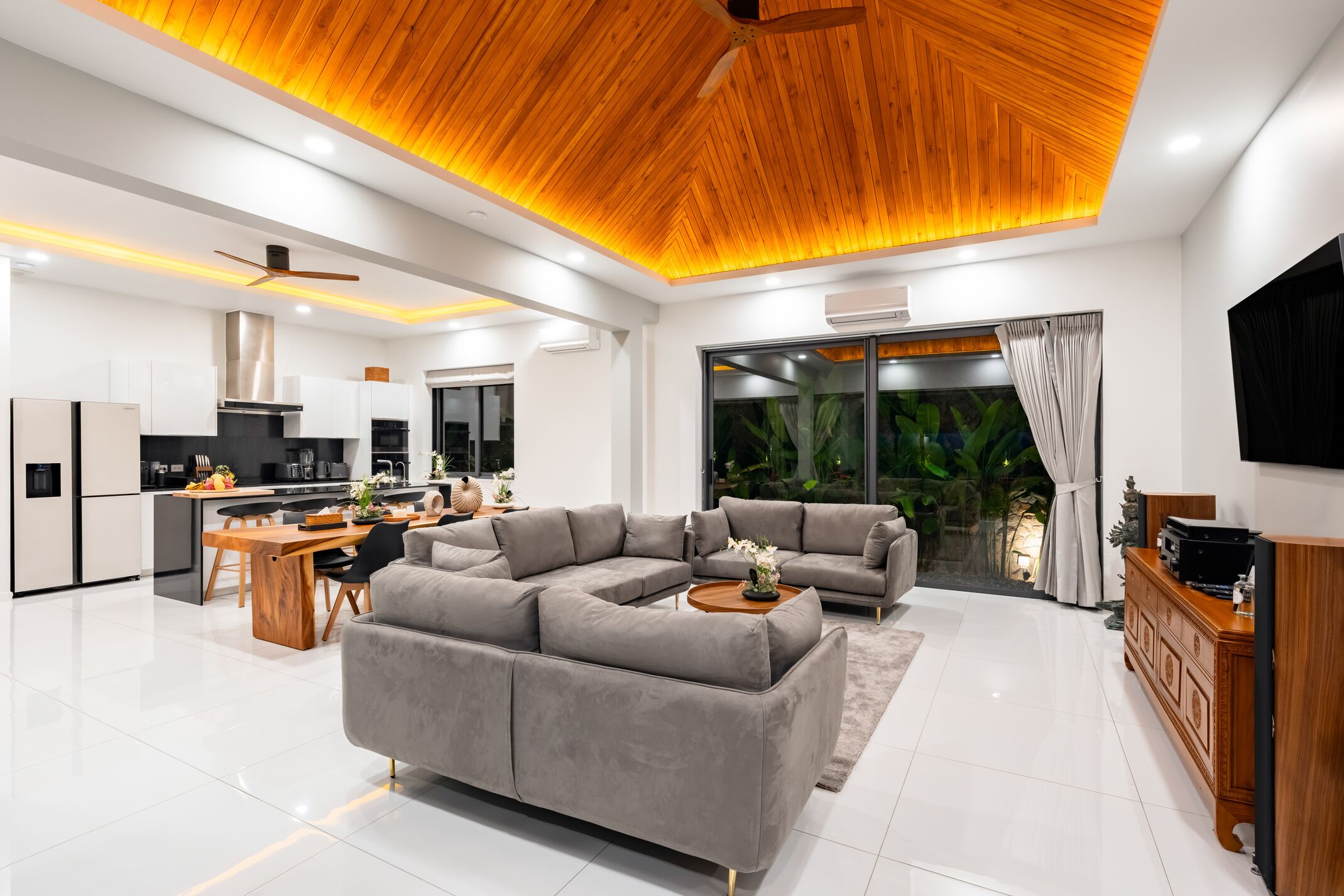 Exclusive Villa | Living area | 65-inch TV with cable channels