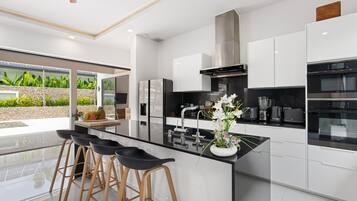 Exclusive Villa | Private kitchen | Full-size fridge, microwave, oven, stovetop