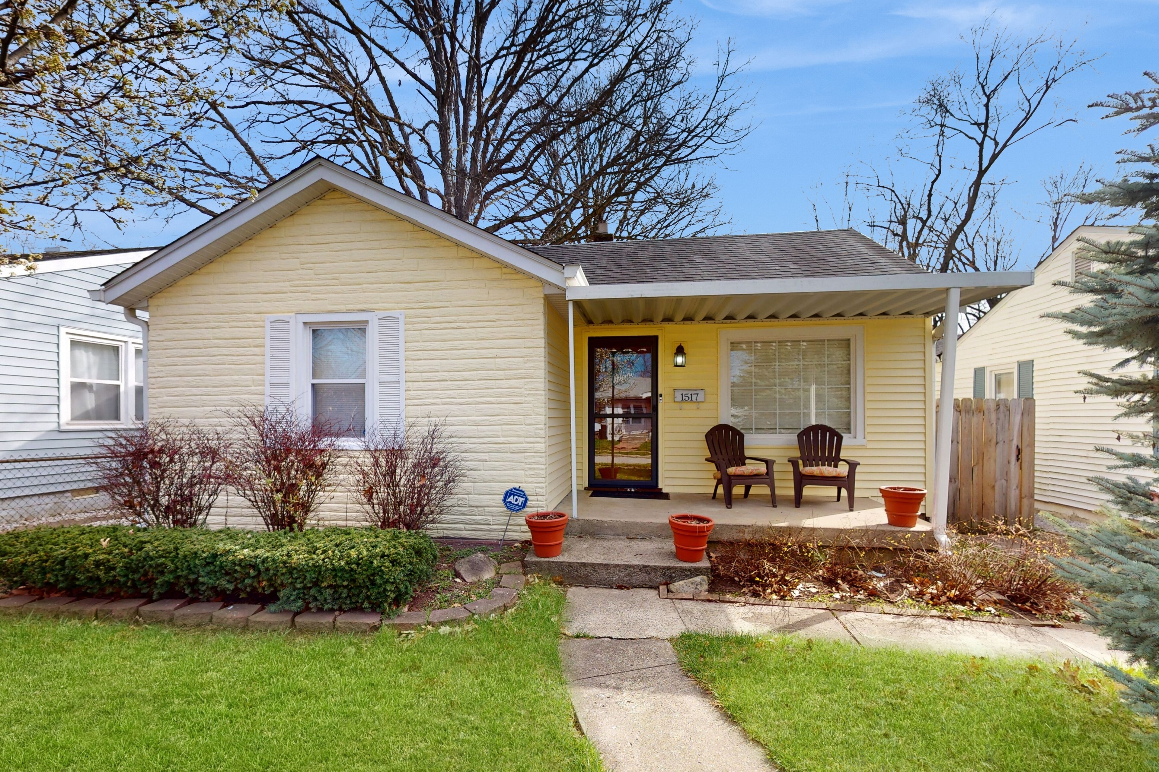 Cottage with front porch, fenced yard, washer/dryer, & AC - convenient location