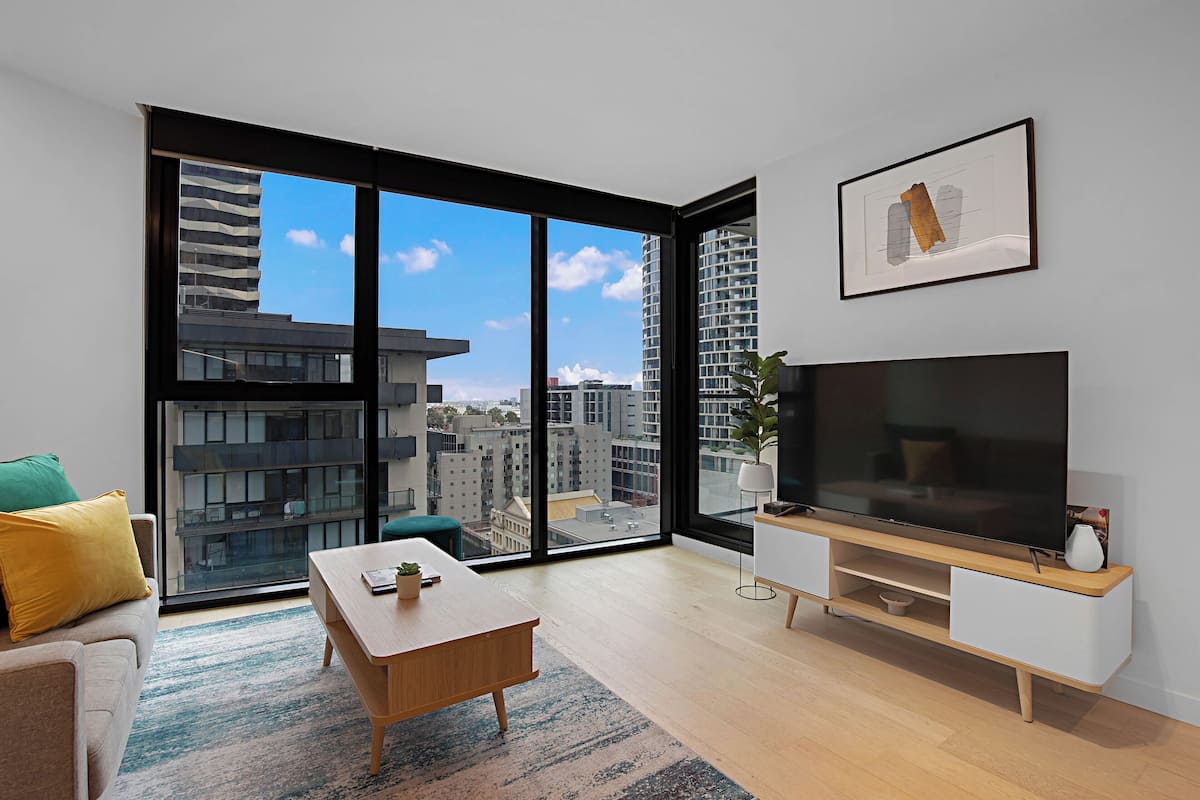 Apartment, 2 Bedrooms | Living area | 55-inch flat-screen TV with cable channels