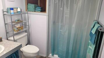 Shower, hair dryer, towels, soap