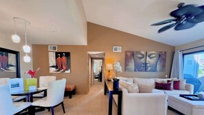 A spacious living area with a dining table, sofas, and a ceiling fan. - New! Downtown Zen Oasis: Best Value, 2 Patios (Palm Springs)